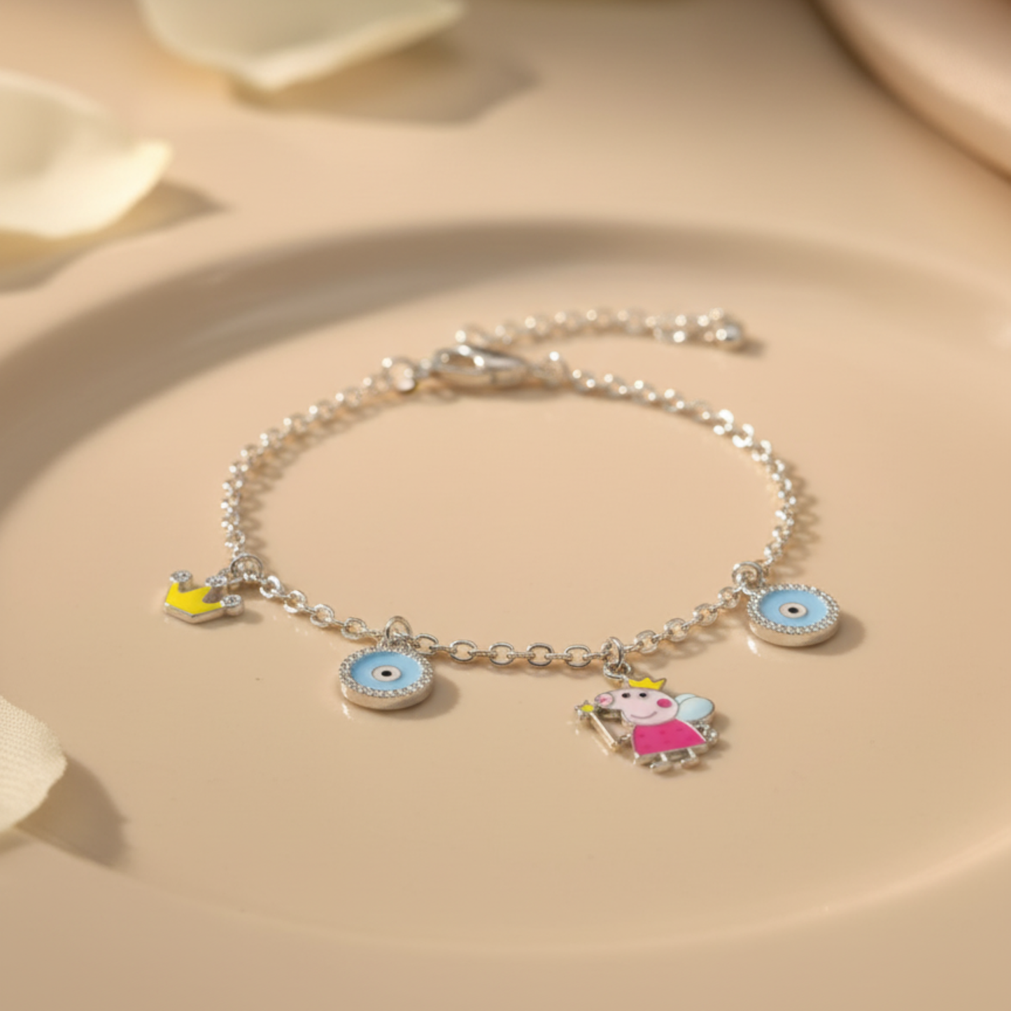 Silver bracelet with colorful charms on a beige surface
