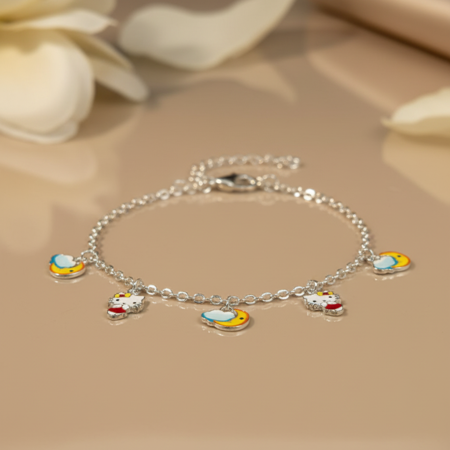 Silver bracelet with colorful charms on a beige surface