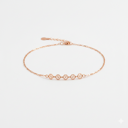 Rose gold bracelet on a light gray background