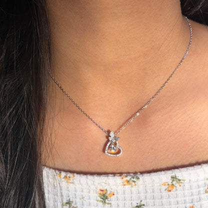 Necklace with a pendant worn by a person, close-up view.
