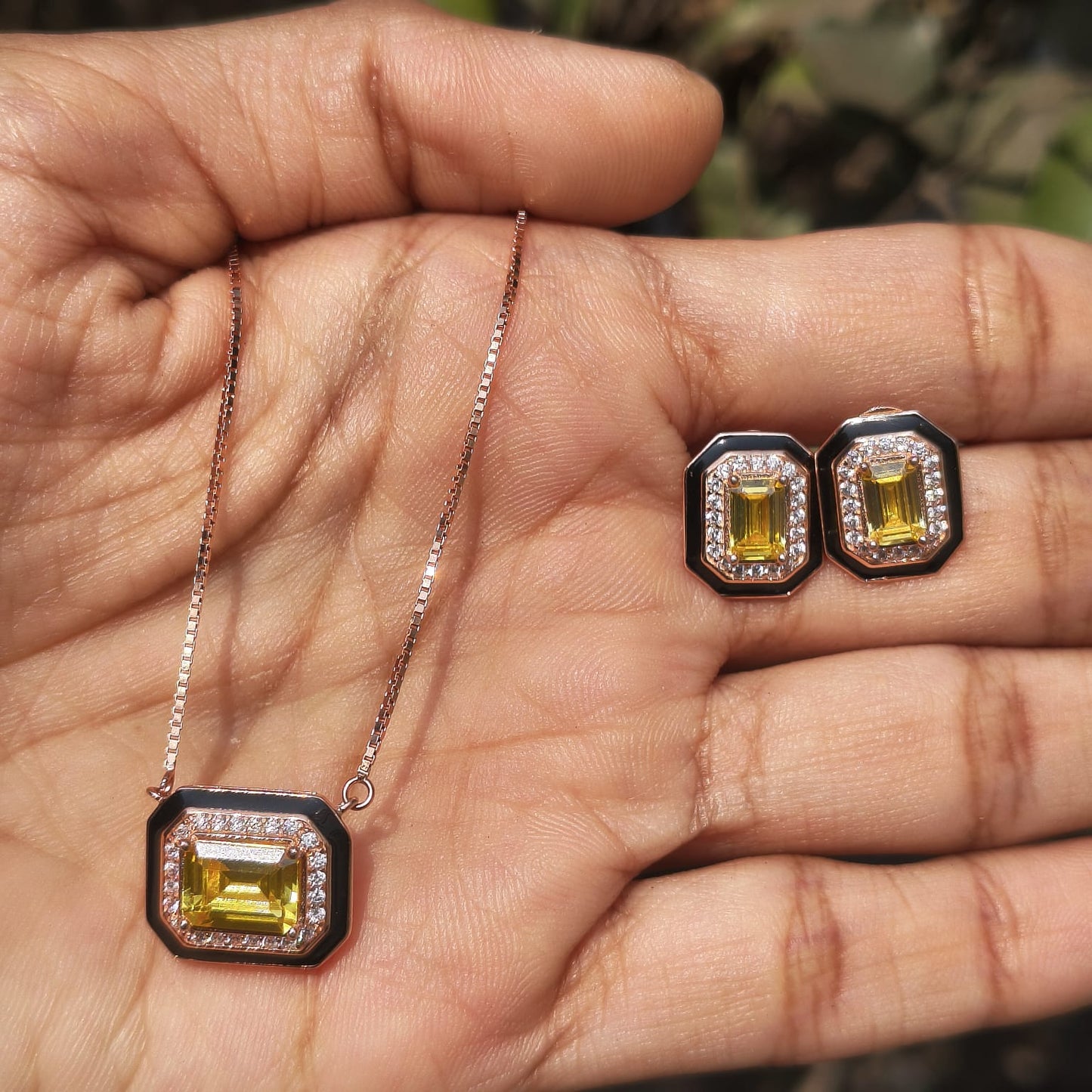 Yellow gemstone jewelry set on a hand