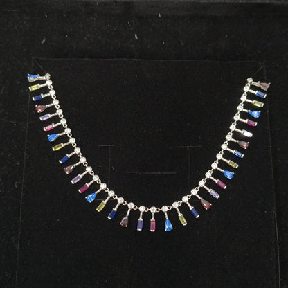 Necklace with multicolored beads on a black background