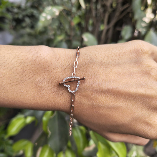 Bracelet on a wrist with a blurred green background